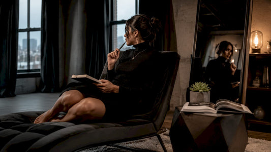 Woman journaling self-reflection at home