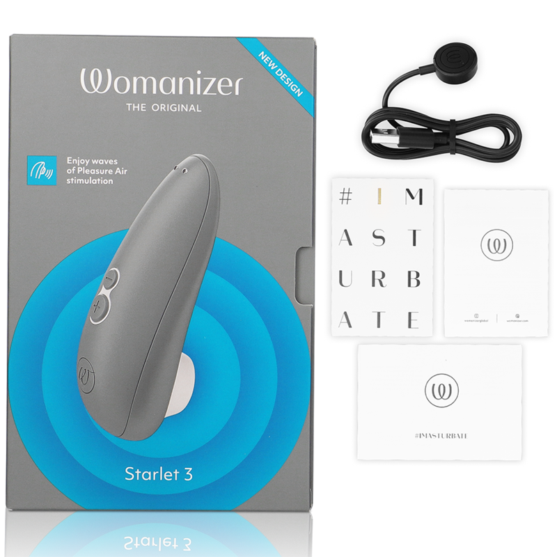 Gray Womanizer Starlet 3 clitoral stimulator with two buttons, charging cable, user manuals, and packaging box.