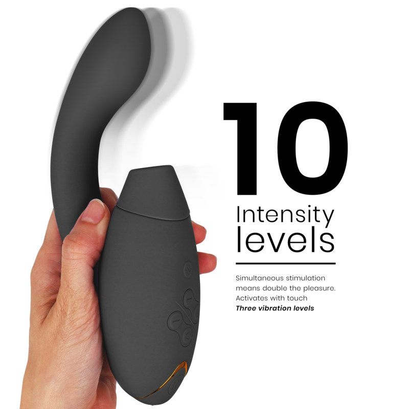 Black curved dual stimulator with ergonomic handle held in hand, displaying 10 intensity levels text.