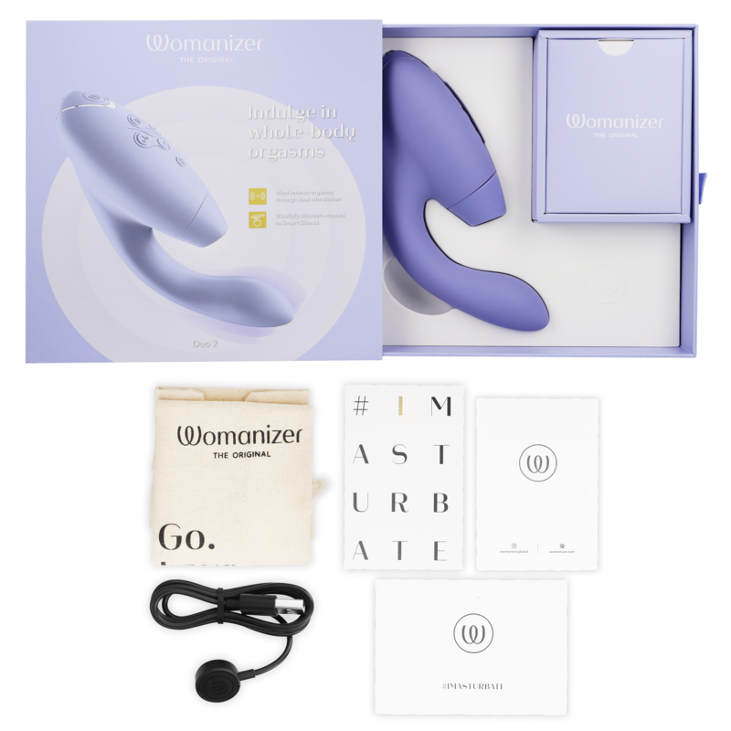 Lilac dual-stimulation personal massager with sleek ergonomic design, box, USB charging cable, drawstring pouch, and manuals.