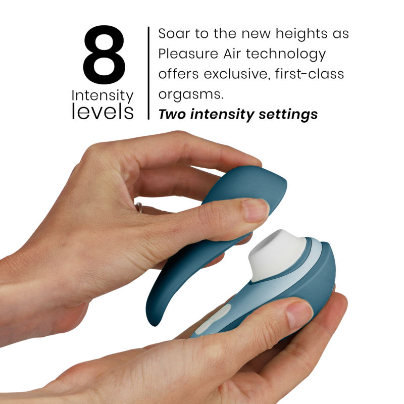 Blue Womanizer Liberty 2 clitoris stimulator with ergonomic design held in hand.