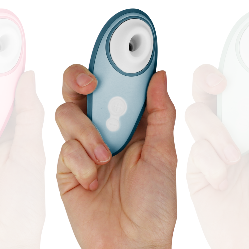 Blue handheld clitoris stimulator with suction nozzle and control buttons held in hand.