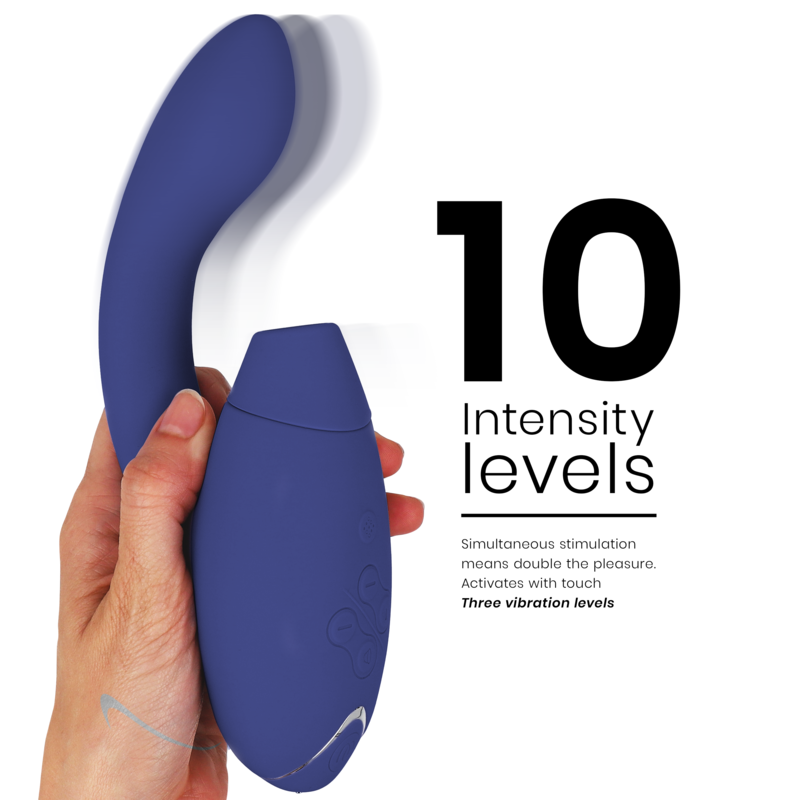 Blue dual-stimulator with curved design held in hand, featuring control buttons and textured grip.