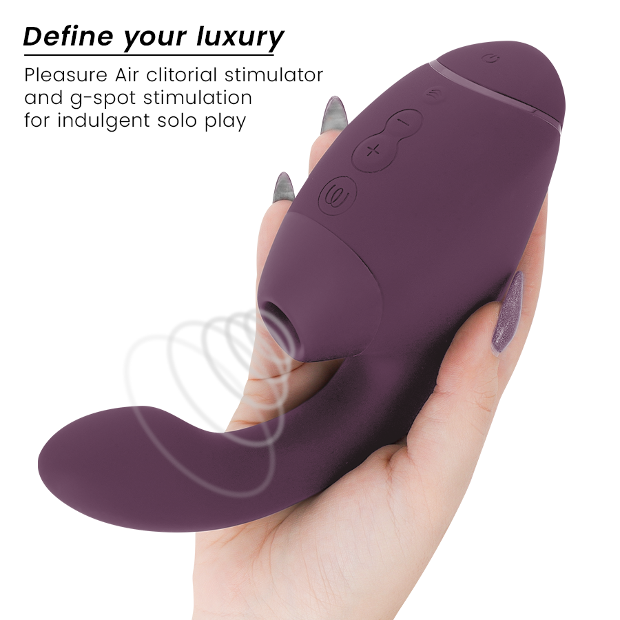 Dark purple dual clitoral and G-spot stimulator with ergonomic curved shape and control buttons.