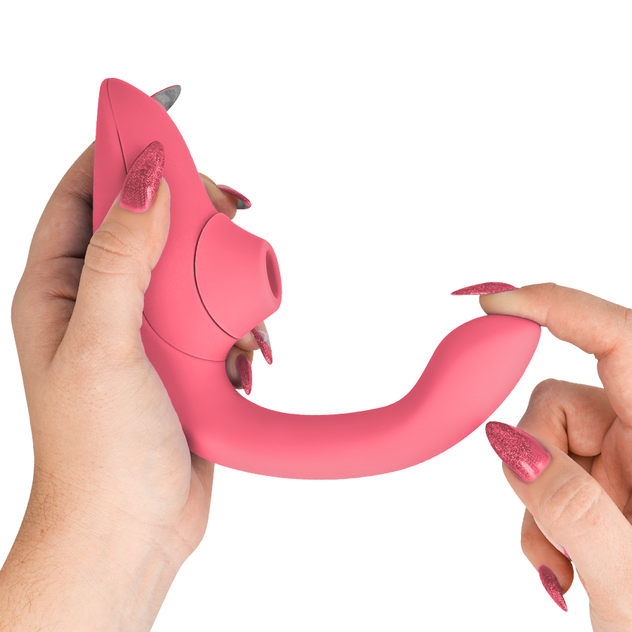 Vibrant rose curved rabbit vibrator stimulator with flexible silicone body held in hands.