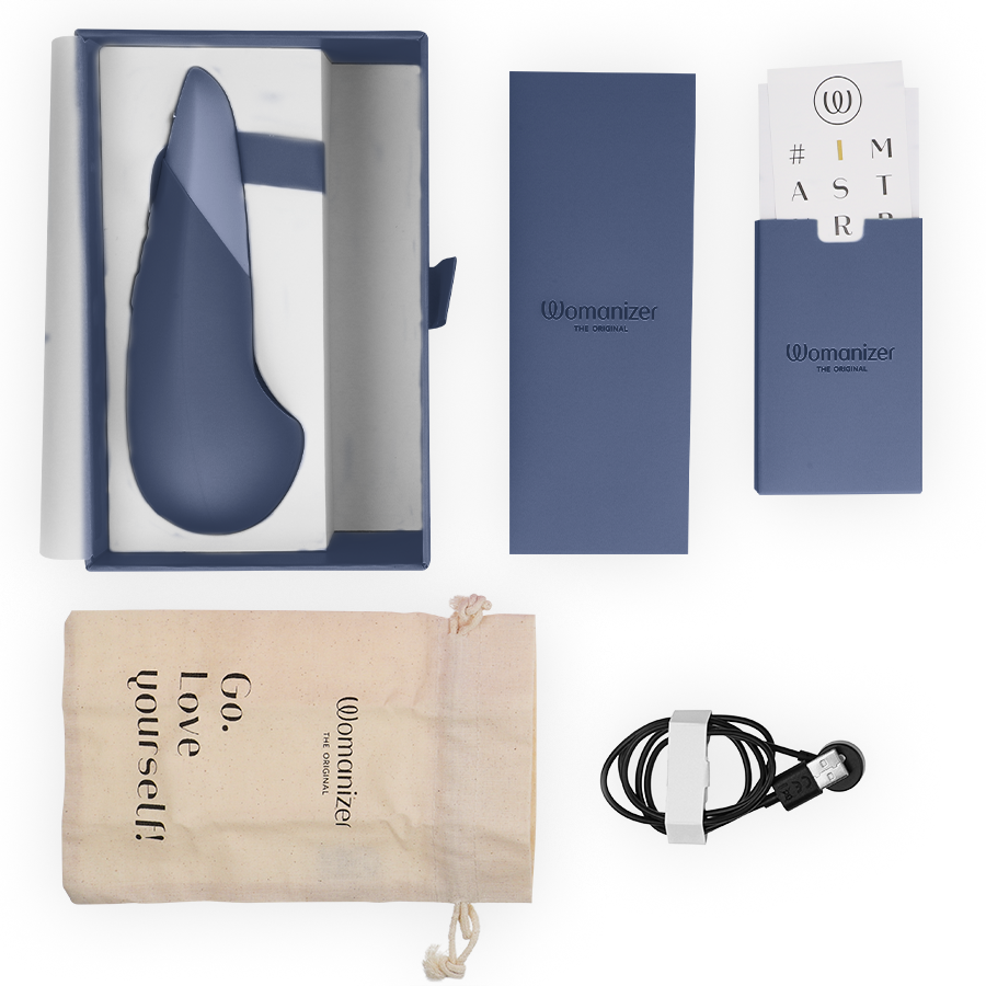 Dark blue silicone silent vibrator with curved tip in white and blue box, beige drawstring pouch, black USB charging cable,.
