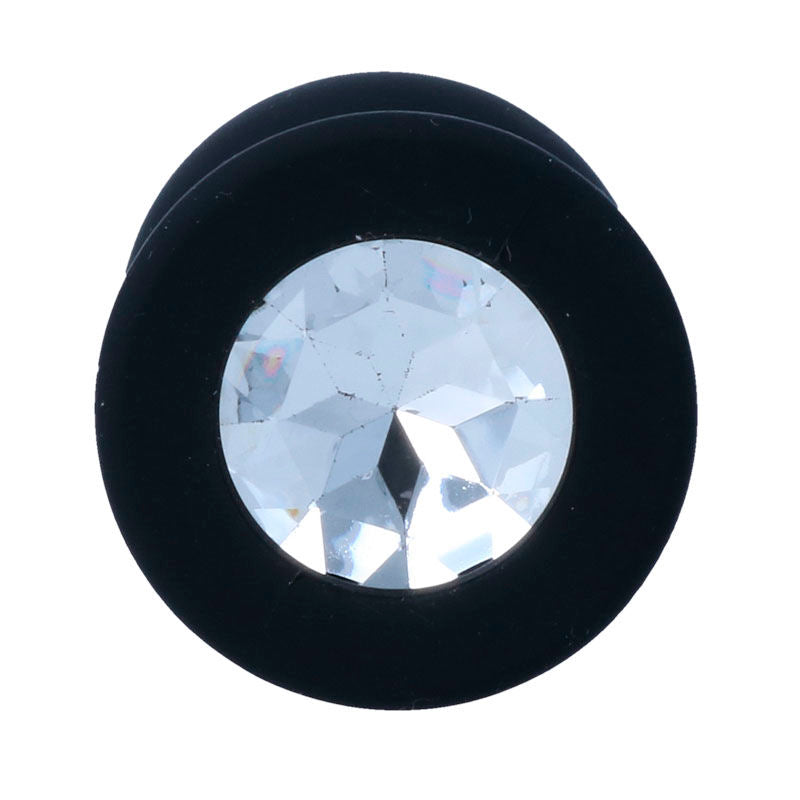 Black silicone anal plug with large clear faceted gem base and tapered tip.