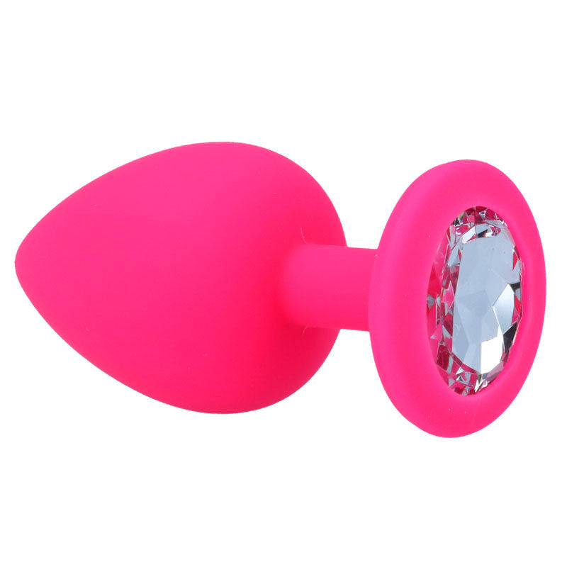 Fuchsia silicone anal plug with tapered tip and jeweled base.